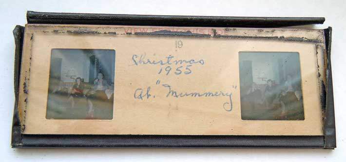 Glass-bound stereo slide with detached edge tape; film must be removed from glass